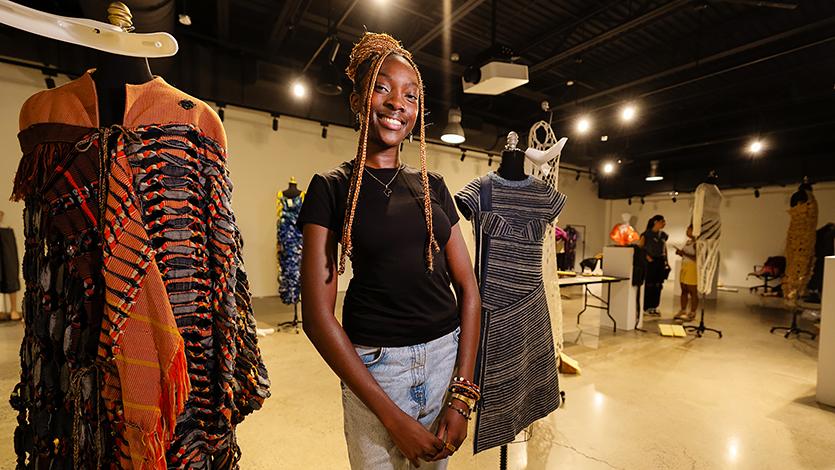 Kunda Nampasa ’25 preparing for the exhibit at Steel Plant. Photo by Nelson Echeverria/Marist College.